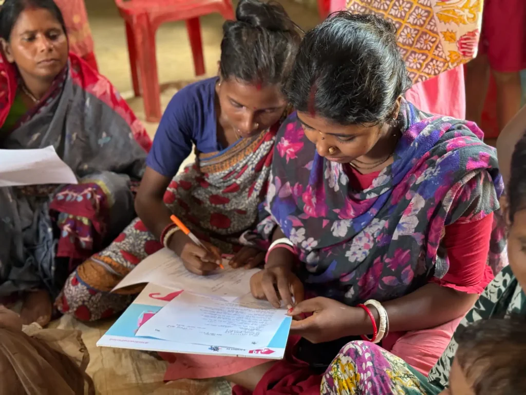 Women receiving climate-smart menstrual hygiene management solutions