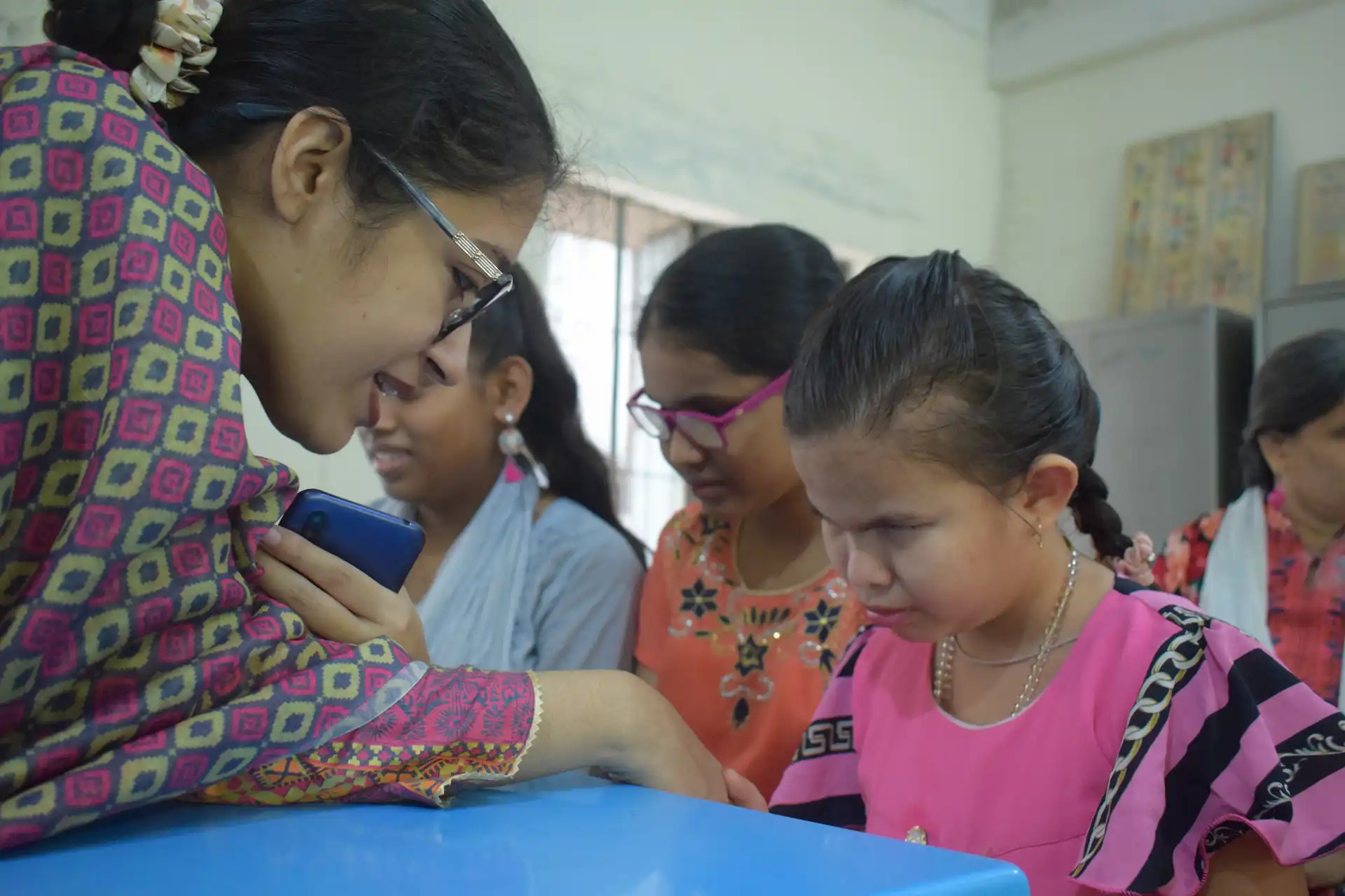 A visually impaired girl learning through tactile materials